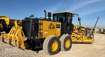 Used Komatsu Motor Grader in yard
